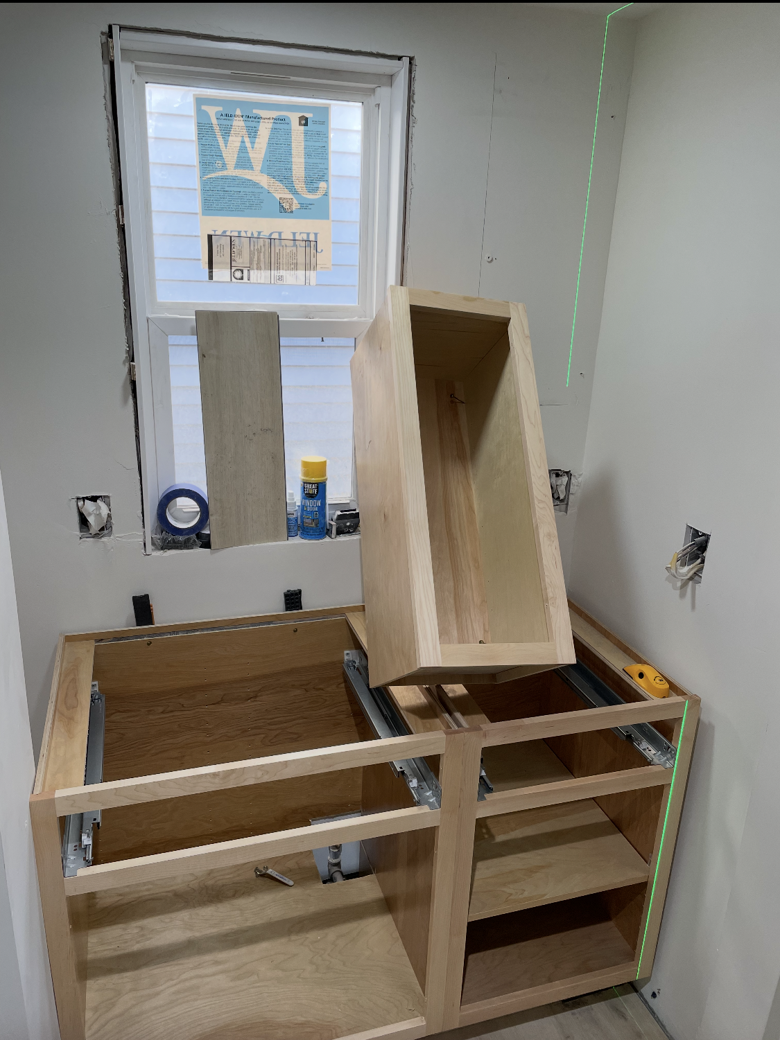 Cabinet installation and layout using laser level alignment