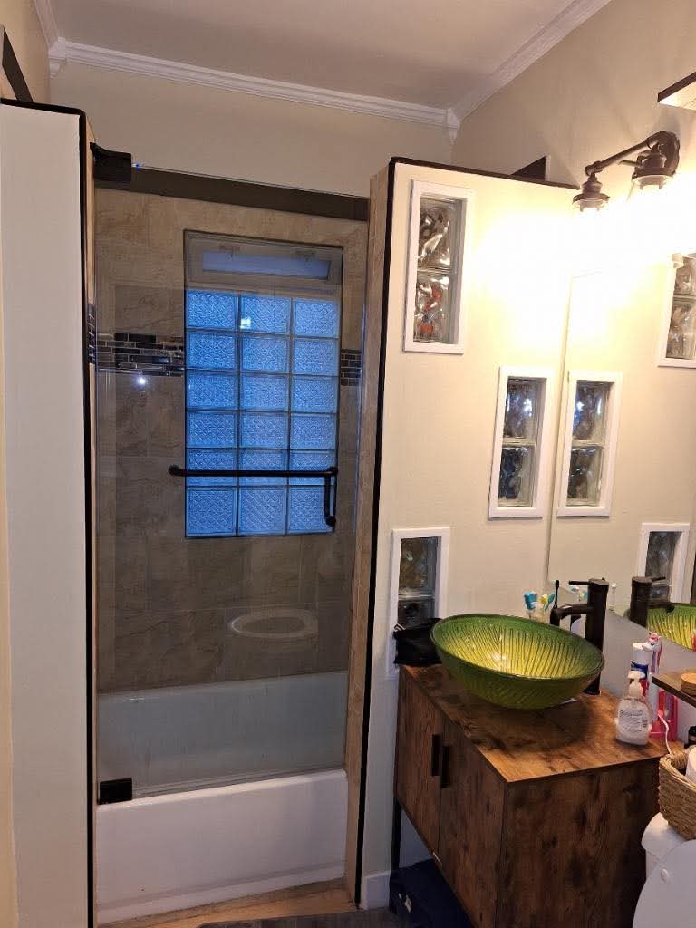 Finished bathroom project with updated shower and trim details