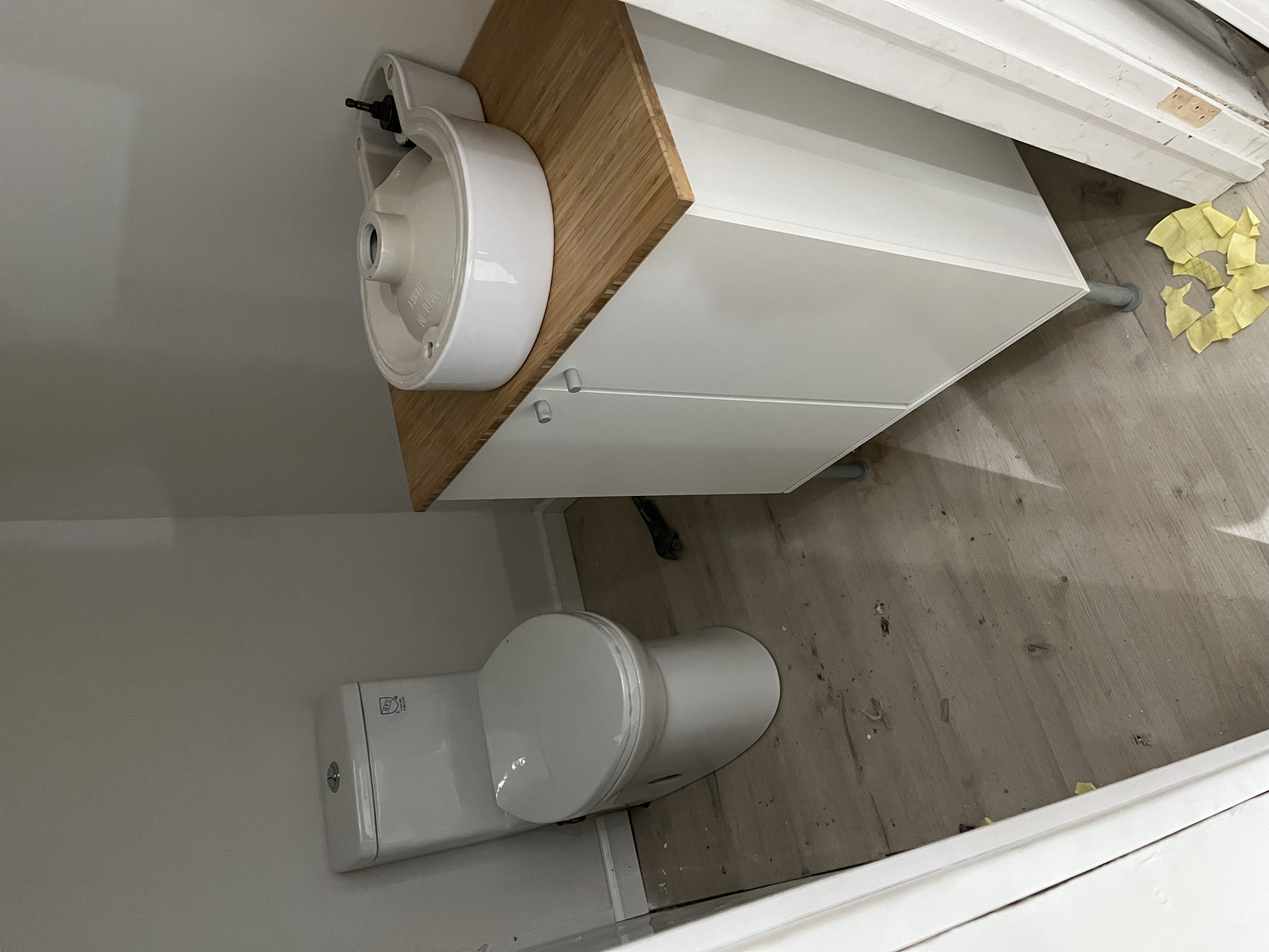 Bathroom vanity, toilet, and flooring installation